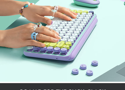 Teclado Logitech Pop Keys vista diagonal mostrando colores menta violeta blanco amarillo
