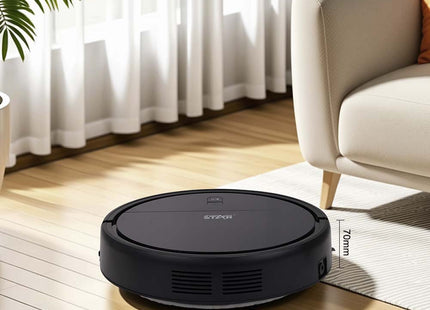 Robot aspiradora compacta ST-2241 limpiando debajo de sofá en sala de estar