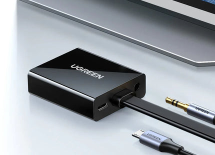 Adaptador UGREEN MM103 en uso conectando dispositivo HDMI a monitor VGA