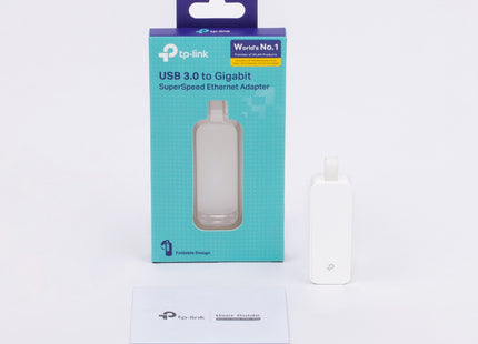 Adaptador TP-Link UE300 completo sobre fondo blanco vista de producto