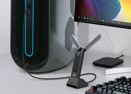 TP-Link BE6500 adaptador WiFi tribanda vista de perfil izquierdo